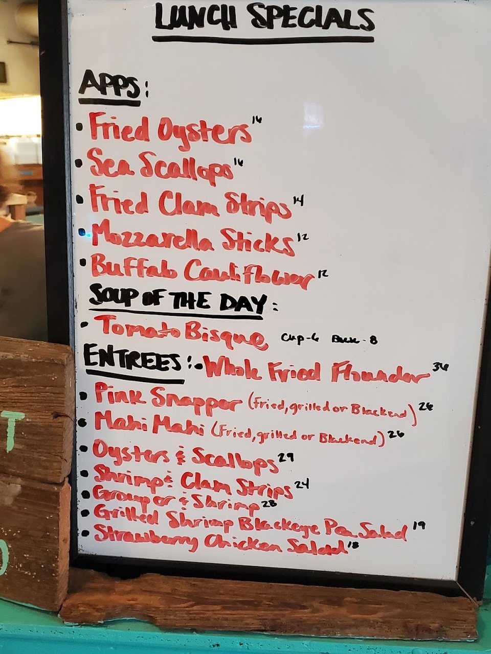 Restaurant menu showing burgers, shrimp, and flounder.